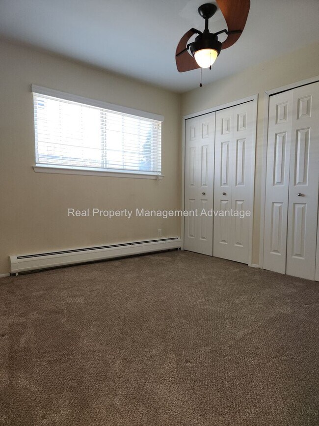 Building Photo - Spacious, Updated Condominium with Two Ful...