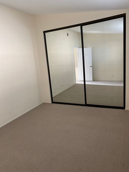 Bedroom with closet doors - 1209 Robinson Ave