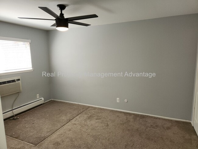 Building Photo - Spacious, Updated Condominium with Two Ful...