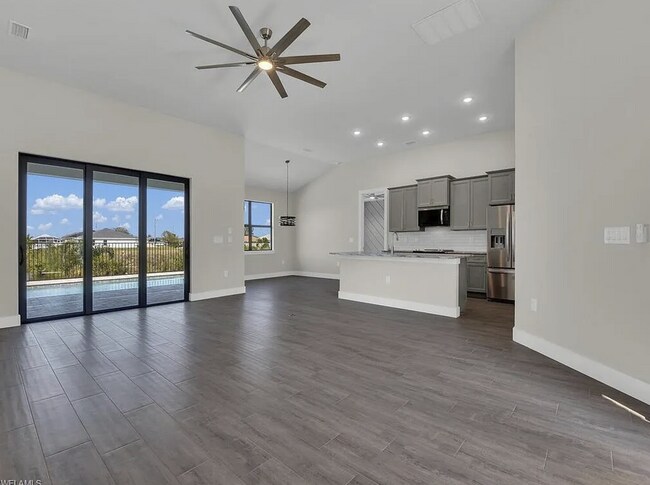 Building Photo - Almost New Construction Waterfront Home in NE Cape Featuring A Pool, Fenced Yard & More! COMING SOON