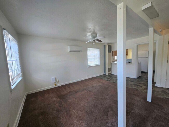 Building Photo - Cozy 2 Bed, 2 Bath Home with Parking Spaces and a Fenced Backyard!
