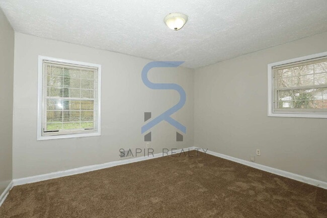 Building Photo - Timeless Ranch Charm in a Vibrant, Peaceful Corner of South River Gardens