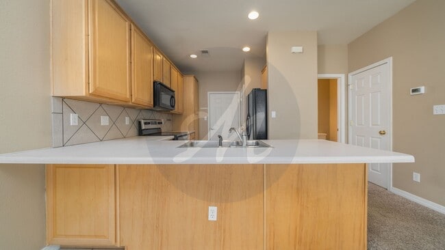 Building Photo - Spacious 3BR Townhome with 2-Car Garage & Private Covered Balcony