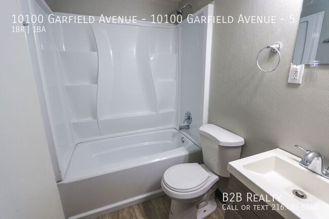 Building Photo - "Charming 1-Bedroom Oasis: Your Perfect Bl...