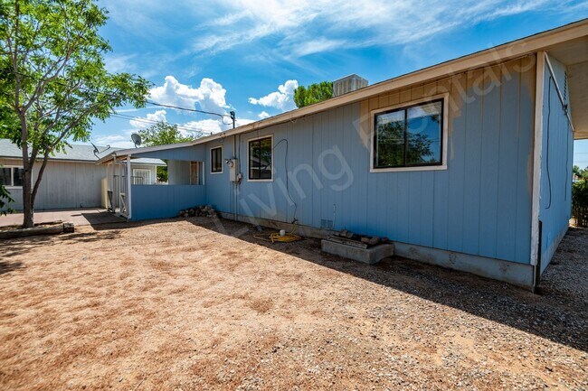 Building Photo - LARGE FENCED YARD WITH DETACHED GARAGE
