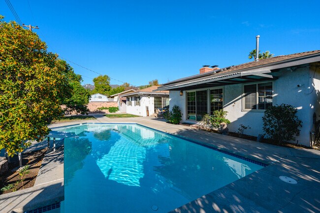 Building Photo - Luxury Estate with Sparkling Pool & Elegant Amenities
