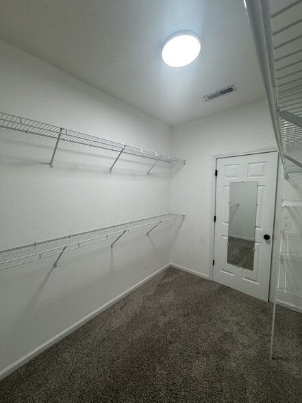 Master walk-in closet. - 1701 Water Oak Dr