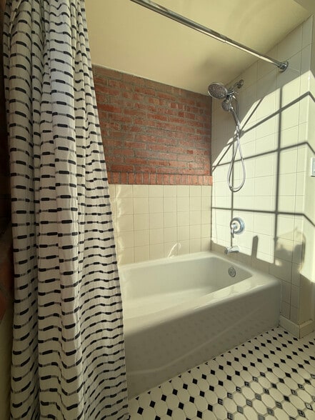 dual shower heads - 300 Tijeras Ave NE