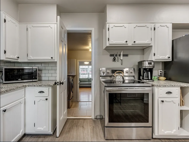 Hallway off kitchen leads to laundry room and bonus room - 2516 NW 49th St