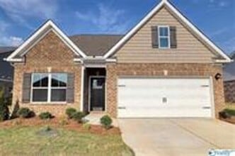 Building Photo - COMING SOON! Welcome to the Carlyle—where classic brick farmhouse charm meets a sleek, modern lif...