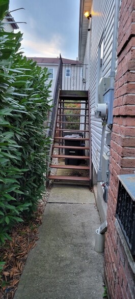 Stairs going up to the apartment - 128 College Ave
