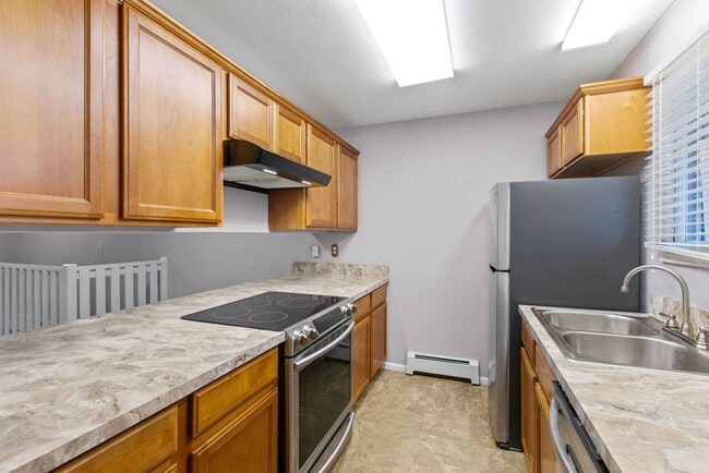 Building Photo - Students Welcome! Spacious 2-Bedroom Condo with Garage and Basement