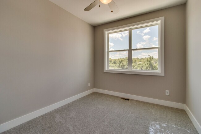Third floor bedroom with ceiling fan and large closet - 707 Vernon Ave