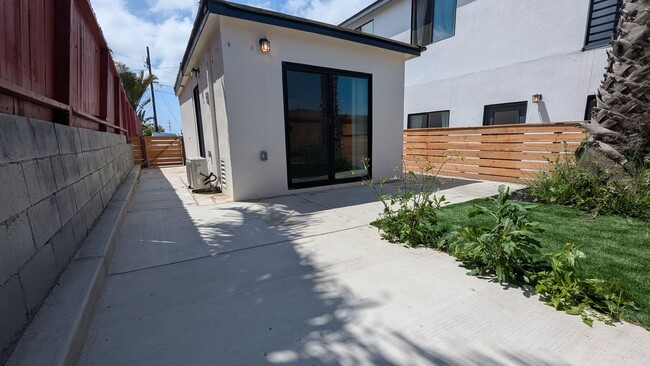 Building Photo - Fenced Private Yard in Newer Build Studio ...