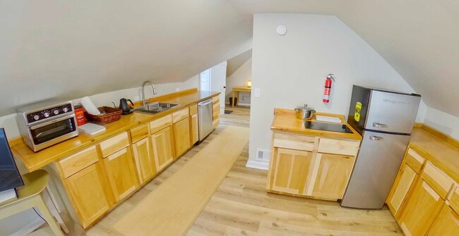 Building Photo - Two Updated Kitchens + Waterfall Shower + ...