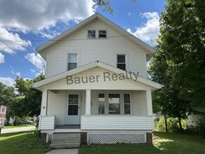 Building Photo - Three bedroom home with two car, detached garage!