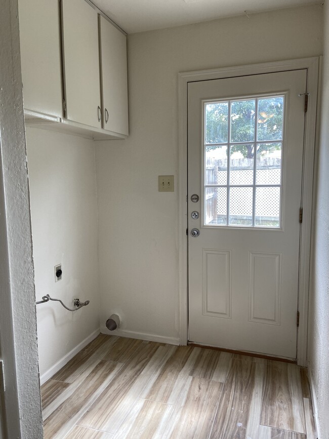 Laundry area with storage - 12811 Broughton Way