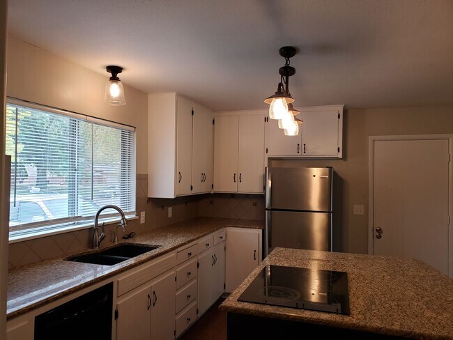 Building Photo - 4 bed / 1 bath 2 car garage home available...