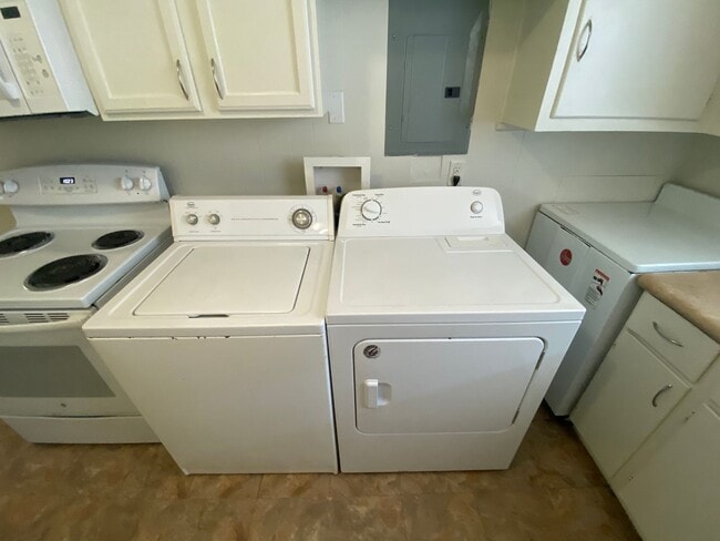 Building Photo - Private carport, in-unit laundry, and the Lakewood strip right outside your door.