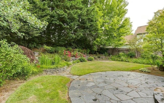 Building Photo - Spacious Four-Bedroom Home with Gourmet Kitchen, Multiple Living Areas, Loft, and Beautifully Lan...
