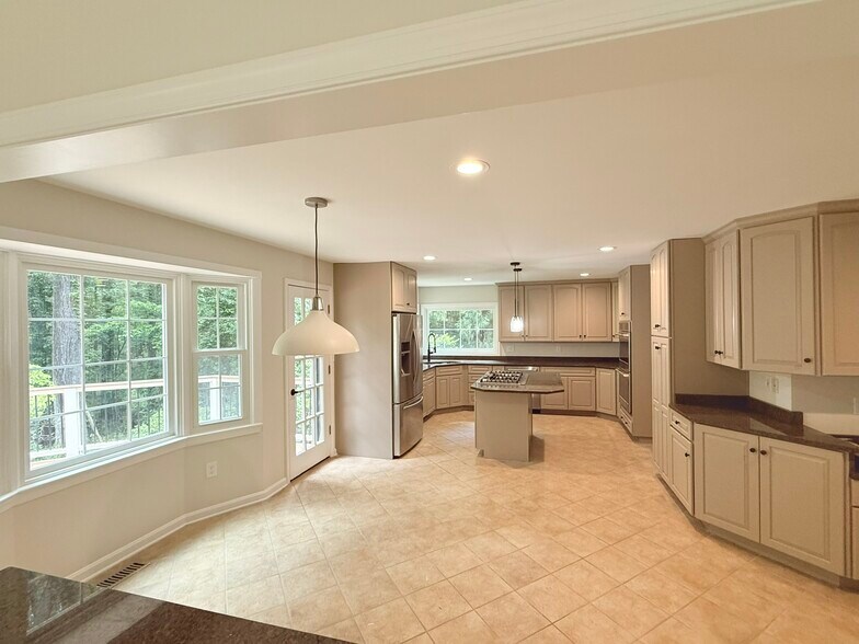 Updated Kitchen with ample storage - 9248 Wood Glade Dr
