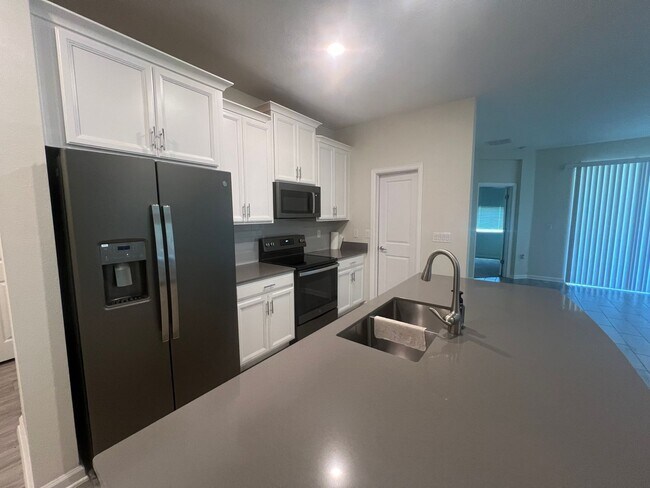 Building Photo - Resort-Style 55+ Living with Peaceful Water Views in Harmony