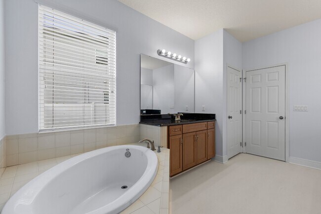 Building Photo - Spacious 6-Bedroom Home Near Lake Nona | 3-Car Garage + Tesla Charger