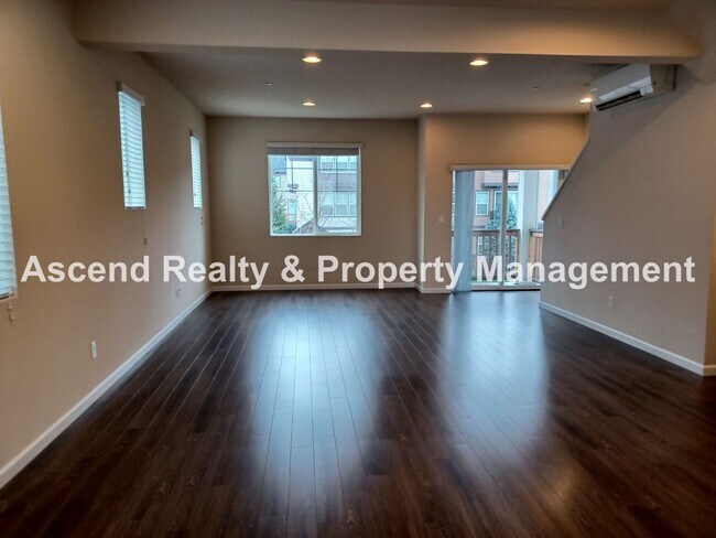 Building Photo - 3 Level End Unit Townhome with Newer Carpet, Open Floor Plan, 2 Balconies, 2 Car Attached Garage ...