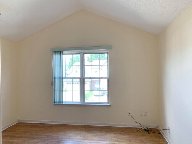Primary bedroom with vaulted ceiling - 7985 Marsha Woods Dr
