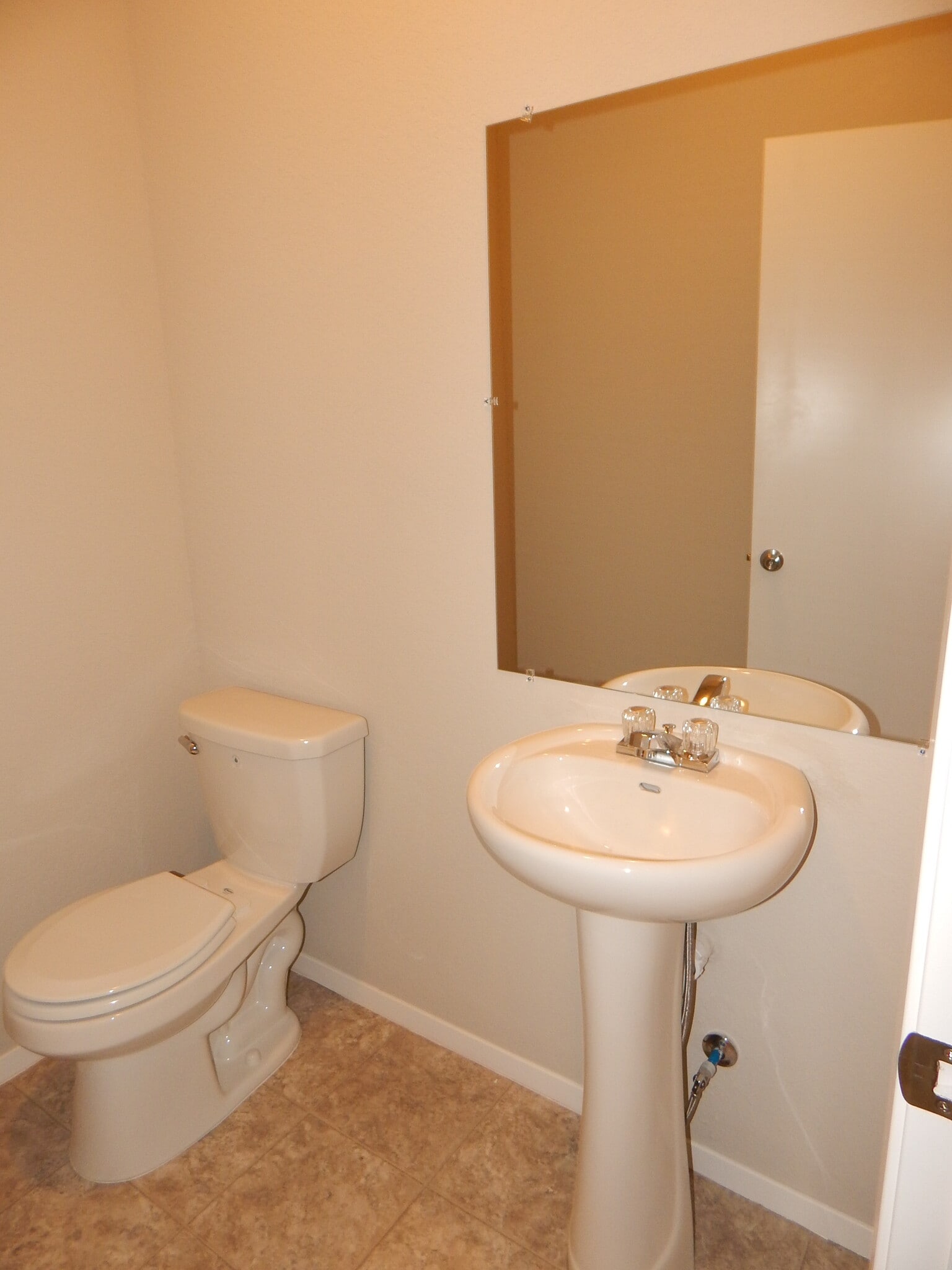 Half bath conveniently located near living area downstairs. - 5074 W Claxton Circle