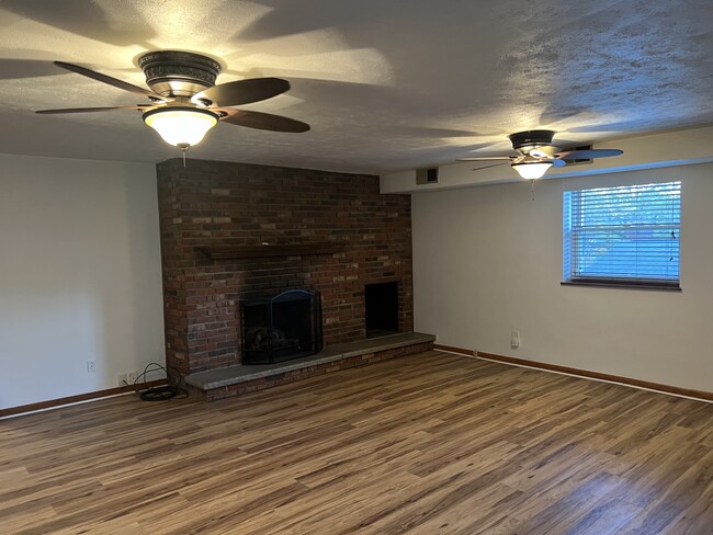 Lower level den. Gas fireplace insert - 1818 Pinewood Dr