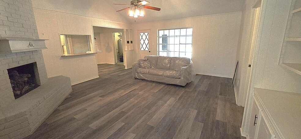 Living room with fireplace and built in cabinets and cloak closet - 12814 Westhorpe Dr