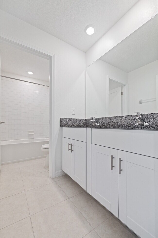 Building Photo - "Spacious 5-Bed Gem in Epperson community ...