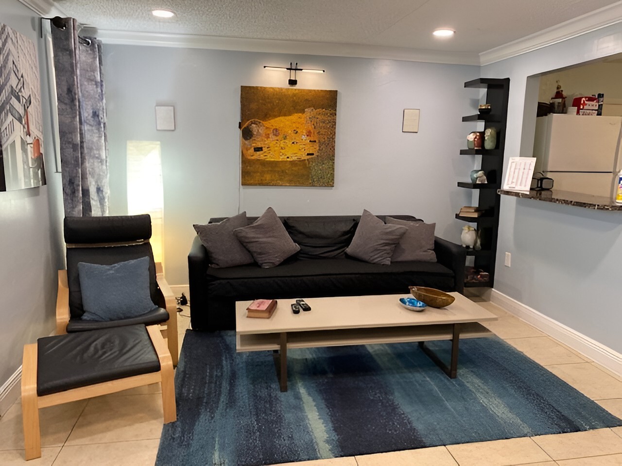 Living room w fold-out couch - 117 NW 47th Ter