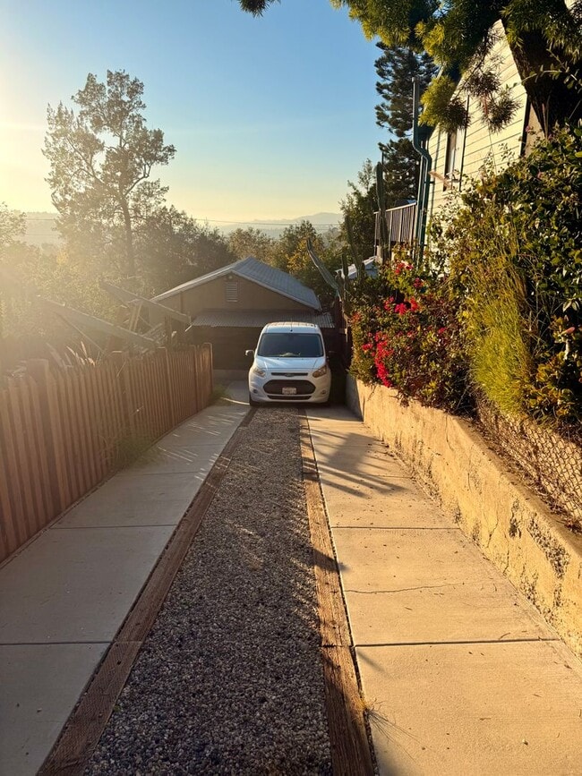 Building Photo - Hilltop Highland Park Sanctuary with Views, Private Gated Yard, In Unit Laundry, Parking & Abunda...