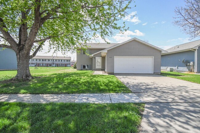 Building Photo - Updated 3BR Split-Level Home with Huge Deck, Fenced Yard & 2-Car Garage Near I-29!