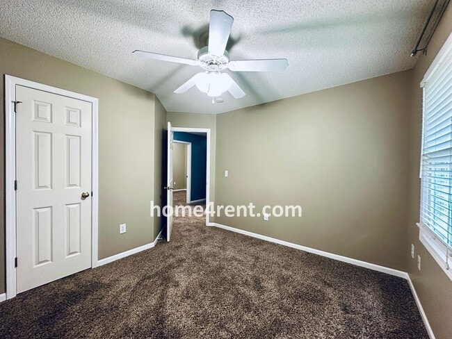 Building Photo - Blue Valley Schools w/ Wood Floors, Finished Basement and a Peaceful, Private Fenced Yard!