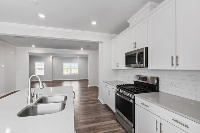 Building Photo - Bright, Spacious & Move-In Ready Townhome ...