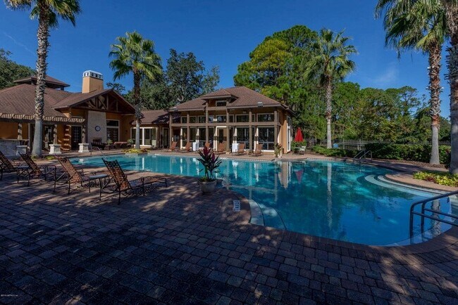 Relax and unwind lounging by one of two, beautiful pools. - 100 Fairway Park Blvd