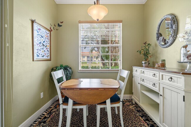 Building Photo - Experience Bell Tower Park. GATED ground floor 2 Bed 2 Bath Den 1 Car Garage Condo.