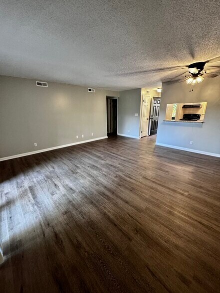 Living room looking to entry and kitchen - 122 Turnwood Ln