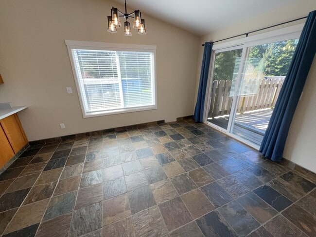 Building Photo - Newley updated 3-bedroom home features fenced yard, garage, and covered patios!