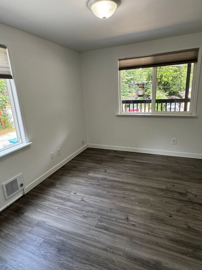 Building Photo - Spacious Two Story (2BR/1BA) Home with Large Fenced-In Yard