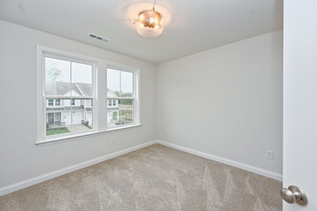 Building Photo - **BE THE LUCKY ONE TO LIVE IN THIS 2024-BUILT TOWNHOME**