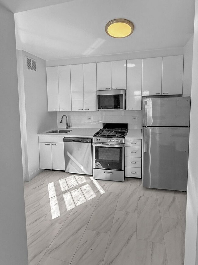 Building Photo - The Leslie — A Private Garden Enclave for the Modern New Yorker