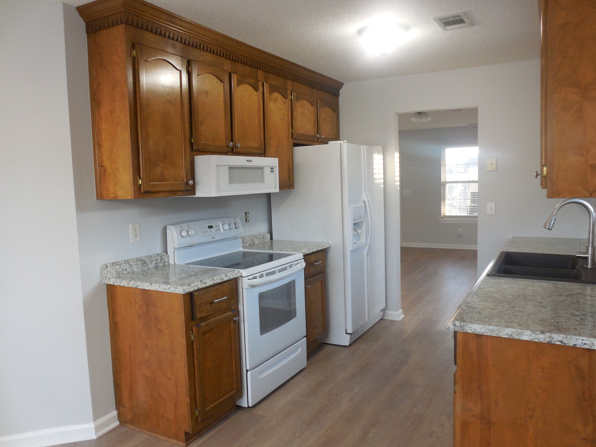 Renovated kitchen with low profile microwave and French door refrigerator - 305 Chadwyck Cir