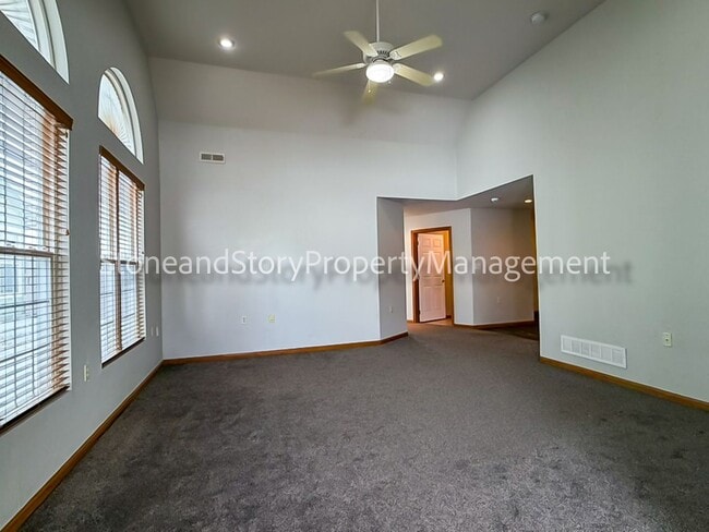 Building Photo - 2 bedroom 1.5 bath duplex with sunroom, 2 car garage and fenced yard