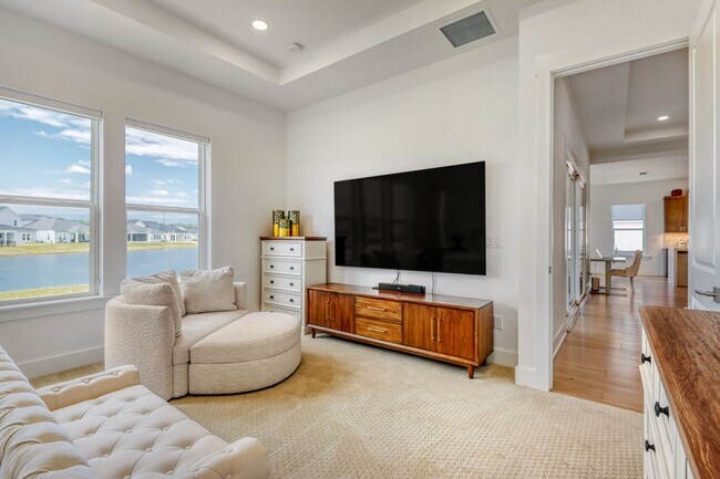 Building Photo - Resort-Style Furnished Lakefront Living in SilverLeaf | 100” Theater & Golf Cart Included