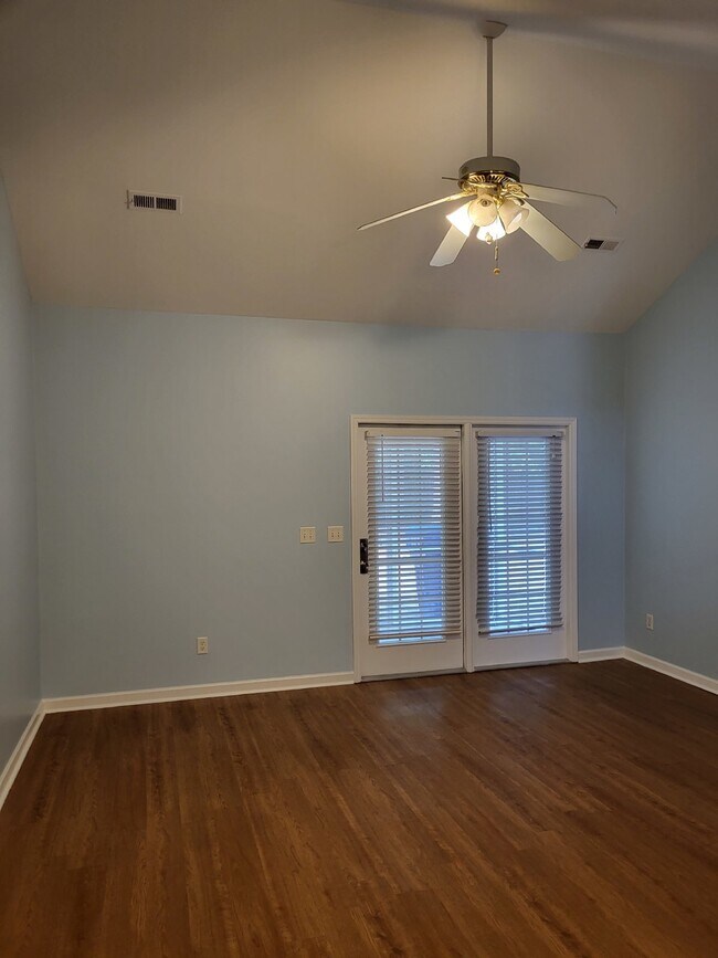 Building Photo - "Charming 2-Bedroom Townhouse on Skillmaster Court with Gleaming Hardwood Floors!"