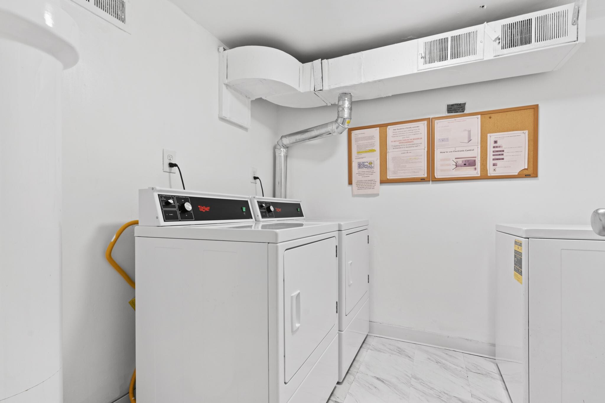 Washer & dryer on floor right across from unit - 118 Monroe St